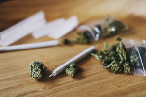 Shot of dried marijuana and a rolled joint
