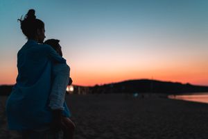 couple at the beach watching the sunset