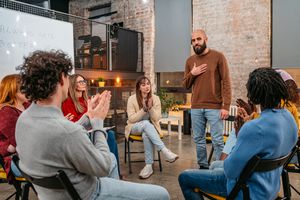 Man talking to the other members of the therapy group