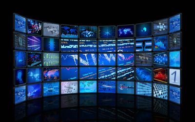 television studio with a variety of TV screens