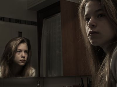 Portrait Of A Young Woman And Reflection