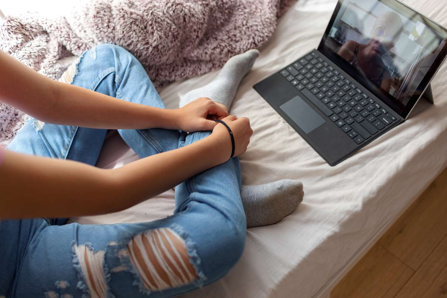 girl has psychotherapy session with her therapist via video call